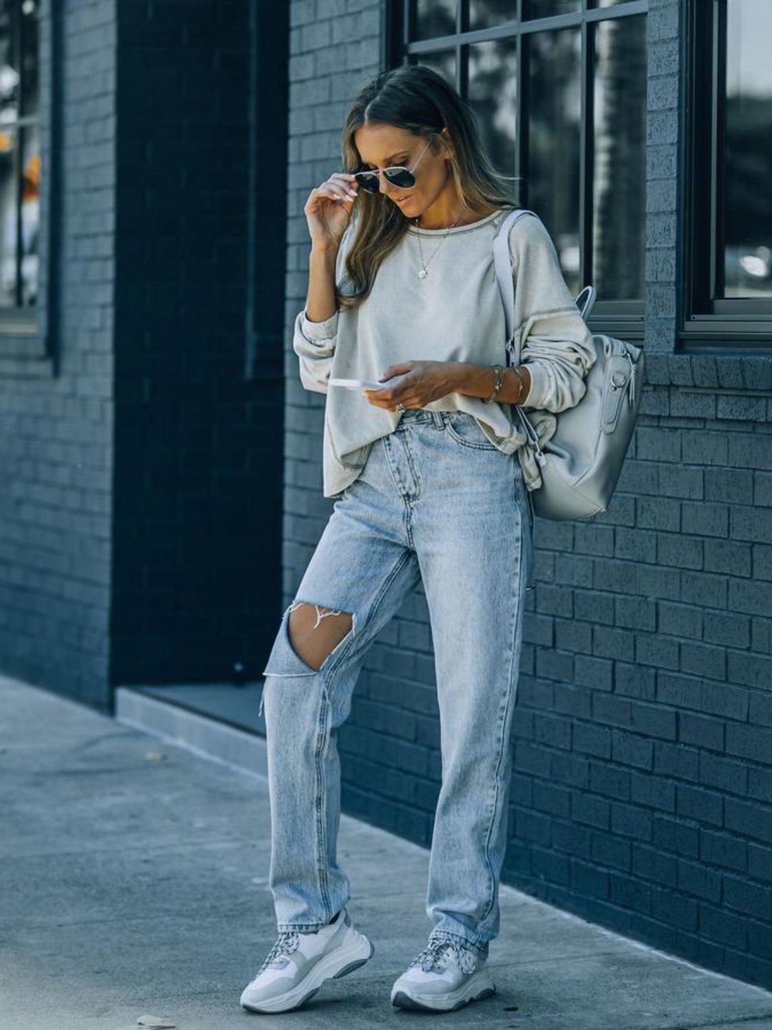 Distressed Asymmetric Waist Jeans - Loulou Boutique